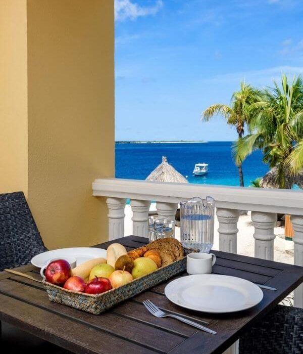 table with fruit overlooking the ocean